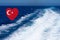 Heart shaped turkish flag on background made of view of deep blue Mediterranian sea