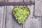 Heart shaped wicker basket full of linden blossoms