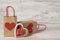 Heart-shaped wooden decor and gift paper bags on the table, festive shopping for St. Valentine\\\'s day