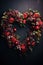 A heart shaped wreath made of flowers and leaves on a black background, AI