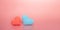 heart shapes blue and orange over pink, care and love concept, assistance or friendship idea, copy space