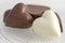 Heart shapped chocolate sweets, brown and white color, transparent retro plate with pralines