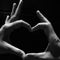 Heart sign by finger in black and white