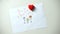 Heart sign lying on family drawing, child dreaming about love and care, adoption