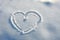 Heart in the snow. background for decoration for the holiday of Valentine\\\'s Day. Cold heart  love. white snow in winter.