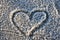 heart symbol on the frosty surface