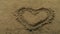 Heart Symbol Has Been Drawn In The Sand
