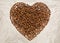 The heart symbol is made up of coffee beans.