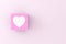 Heart symbol on a pink cube block. Love, relationship and valentine's day concept