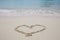 Heart Symbol on sand beach