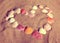 Heart symbol from shells on sand - vintage retro style