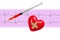 Heart and and syringe over electrocardiogram graph on white