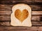 Heart toasted on a slice of bread, on wooden planks
