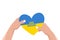 Heart in Ukrainian national flag colors in hands. Human gives heart with text - save Ukraine. Concept of support, charity