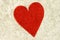 A heart on a vintage playing card.