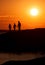 Heart Warming Sunset Silhouette of Dad and Daughters Holding Hands