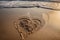 Heart written in the sand on the beach sunset, Generative AI