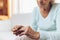 Heartbroken elderly woman holding a wedding ring