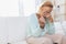 Heartbroken elderly woman holding a wedding ring