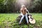 Heartbroken woman in nature with guitar