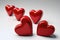 Heartfelt Love: Red Heart Shapes on White Background for Greeting Cards and Invitations.