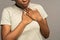 Hearth attack pain: black woman touch chest suffer from heartache and serious respiration problems