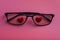 Hearts in glasses on a pink background