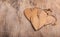 Hearts made of wood in the old worn wooden background. Wooden valentine. Valentine`s day. Copy space.