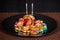 Hearts Shaped Biscuit Tied With Red Ribbon In Non Stick Pan, With Many Color Gems Chocolate