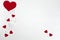 Hearts on a white wooden background. Background for Valentine`s Day. Background for a banner with hearts for girls. Card