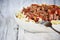 Hearty bowl of beef ragu over pasta