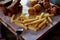 Hearty, fatty dish to the table.Cheese balls, fries and garlic croutons. Beer