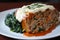 Hearty meatloaf stuffed with gooey mozzarella cheese and spinach, served with a side of creamy mashed sweet potatoes
