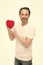 A hearty person. Heart problem and healthcare. Valentines man holding red toy heart in hands. Handsome mature man with