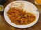 Hearty plate of Chicharron in Red Sauce accompanied by white rice and beans