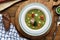 Hearty traditional Dutch pea soup with smoked sausage, rye bread and bacon. Or: `erwtensoep met rookworst, roggebrood en