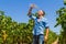 Heat exhausted young farmer cooling himself in