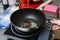 heat the oil in a frying pan for cooking. Woman pours olive oil into the pan.