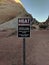 Heat Warning sign in the shade in Nevada desert