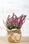 Heather bouquet on white wooden background