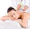 Heathy massage for young woman with aromatic oils