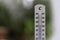 Heatwave: Thermometer in summer on a blurry background, heat