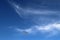 Heavenly background with cirrus clouds against the blue sky on sunny day