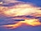 Heavenly blue, yellow and pinkish clouds background