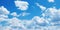 Heavenly Canvas: Blue Sky Adorned with Fluffy White Clouds - Nature\\\'s Tranquil Beauty