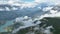 Heavenly Reservoir: Aerial View of the Serene Water Basin Amidst the Majestic Cloud-Enveloped Mountains