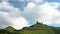 Heavenly Views: Mountain Peak\\\'s Clear Blue Sky and Moving White Clouds.