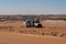 Heavily loaded truck transporting goods parked next to orad in the Sahara desert, Chad, Africa.