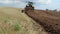 Heavy agriculture machine tractor plow field