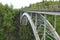 A heavy bridge over an alaskan river.